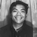 A picture of the author, smiling.